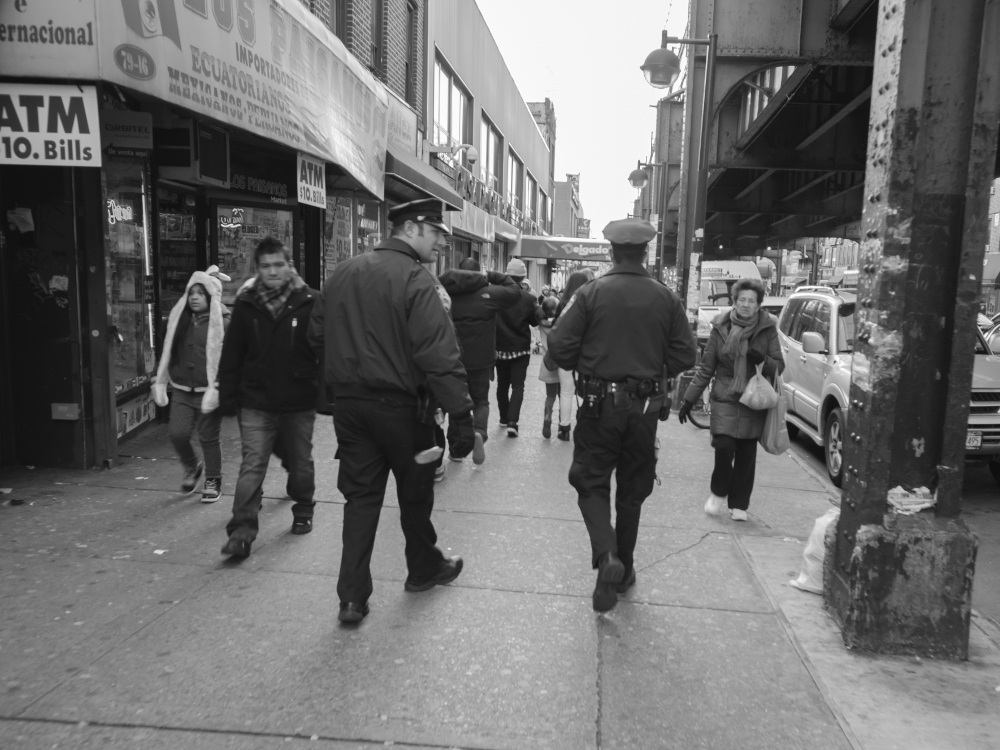 NYPD officers on patrol on Roosevelt Avenue. Photo by Thomas L. Mariadason.
