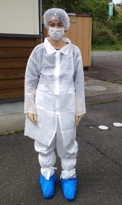 Marie Mockett wearing an anti-contamination suit before entering into the 