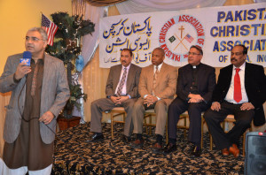 Khan has made connections outside Little Pakistan. He speaks at Brooklyn Pakistan Day program in March 2014 with Borough President Eric Adams and others. (Photo courtesy Shahid Khan)
