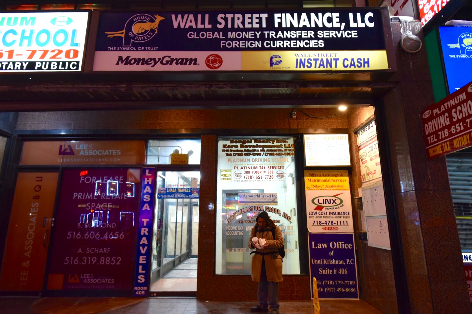 Alternative financial services like these on Broadway in Jackson Heights serve the Nepalese and Tibetan communities in the neighborhood. According to the report, 40 percent of Bangla speakers and 70 percent of Nepali/Tibetan speakers said banks didn’t offer services in their language. (Photo by Thomas Kung)