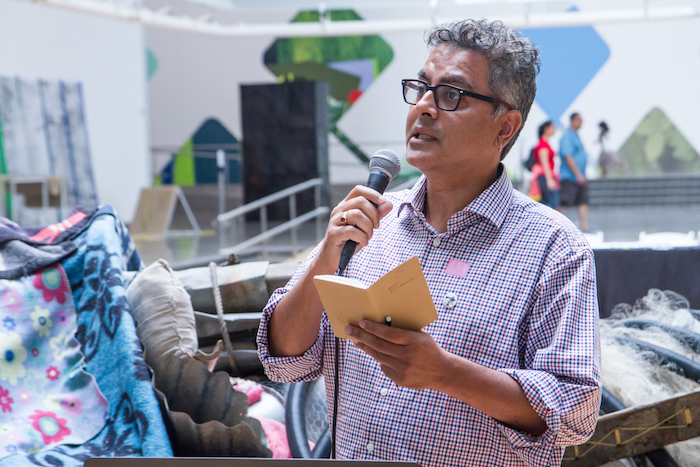 Amitava Kumar reading at the Queens Museum on August 30. Photo by Preston Merchant