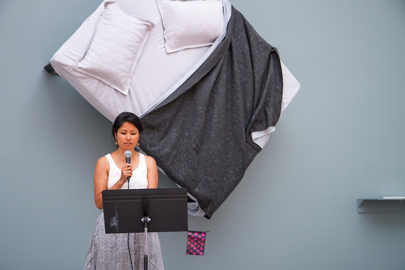 Muna Gurung reads at the Queens Museum on August 30. Photo by Preston Merchant