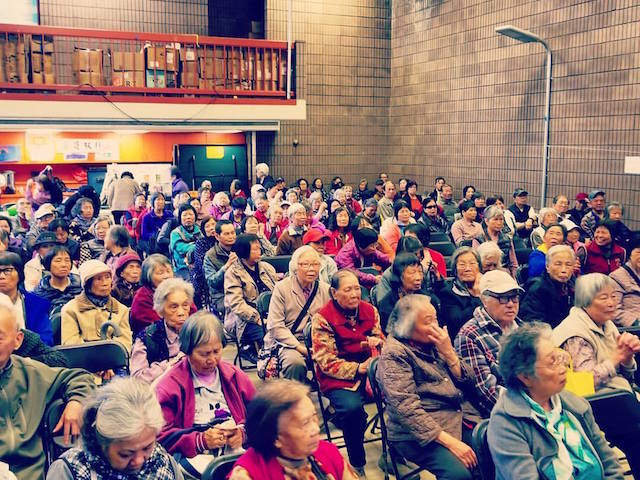 Elderly residents of Chinatown at a presentation